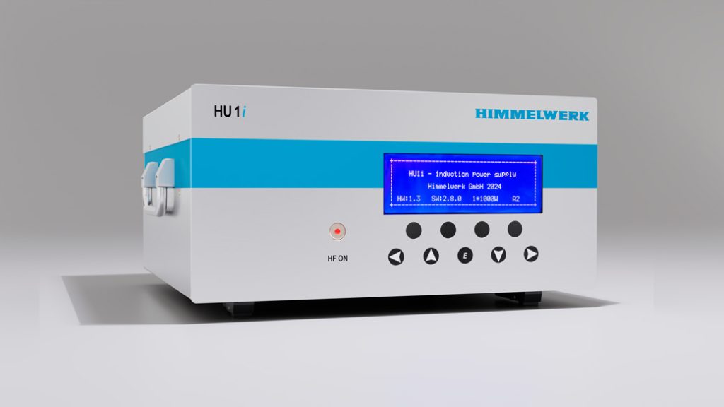 HU 1i table top induction converter. a light grey box with blue accents, buttons and an interface display